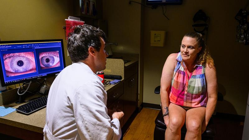 A photo of a woman speaking with a physician.