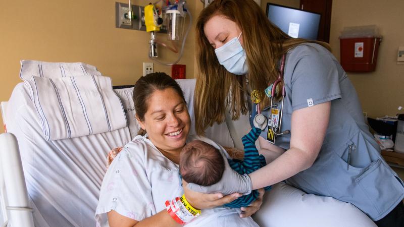 doctor with patient in hospital bed