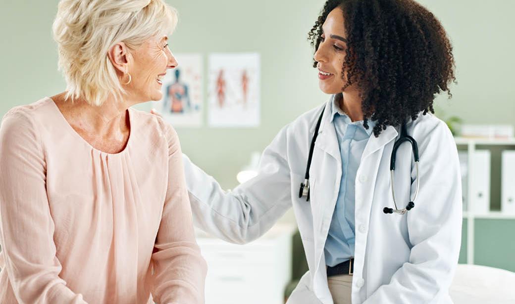 A physician speaks with a patient.